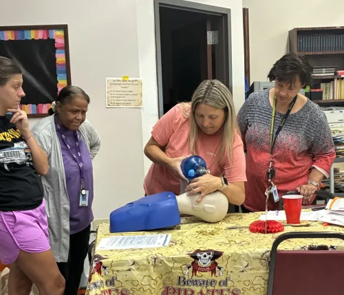 Sacred Heart School faculty receive CPR training the week before classes begin. 