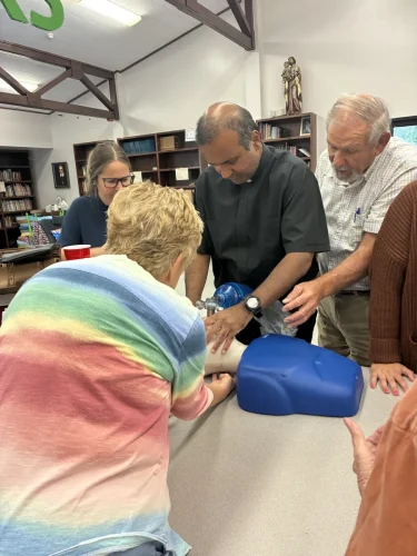 Sacred Heart School faculty receive CPR training the week before classes begin. 