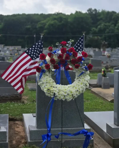 Msgr. Scott Chemino, pastor of St. Anthony of Padua Church, Bunkie, blesses graves of veterans during Memorial Day.