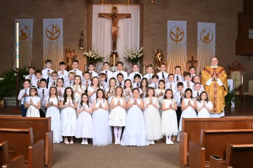 First Holy Communion at Our Lady of Prompt Succor Church, Alexandria.