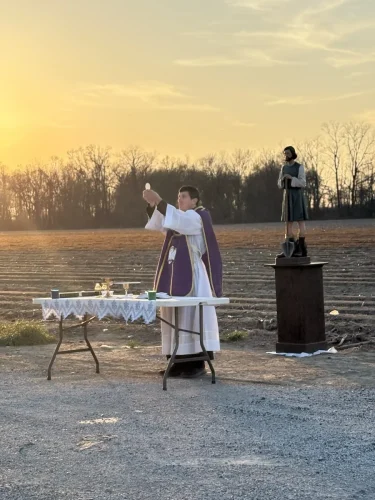 Fr. Taylor Reynolds blessing the fields on March 1.