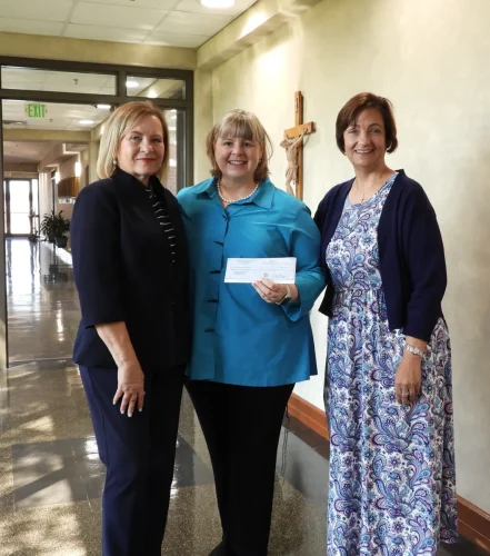 SACRED HEART SCHOOL, MOREAUVILLE. Pictured left to right: Becky Crooks, board member for the Catholic Foundation; Sarah Kramer of Hope Farrar Kramer Education Trust; SHS principal, Amy Coco.