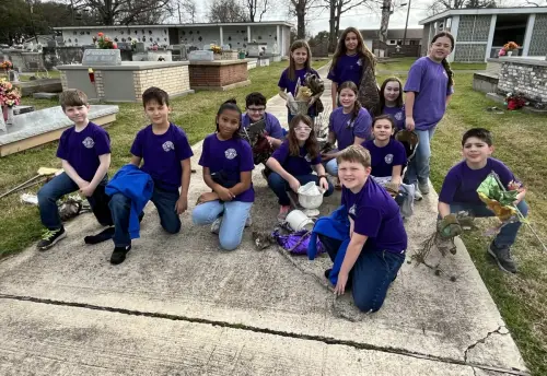 Season of Service, Sacred Heart School's 4th Grade class helped clean up the Sacred Heart Cemetery.