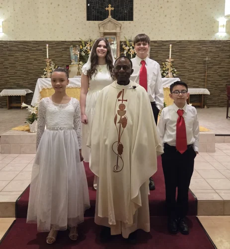 Four made all three Sacraments during Easter Vigil on Saturday, April 4 at St. John the Baptist,  Cloutierville. Pictured with pastor, Fr. Christian Ogbonna.