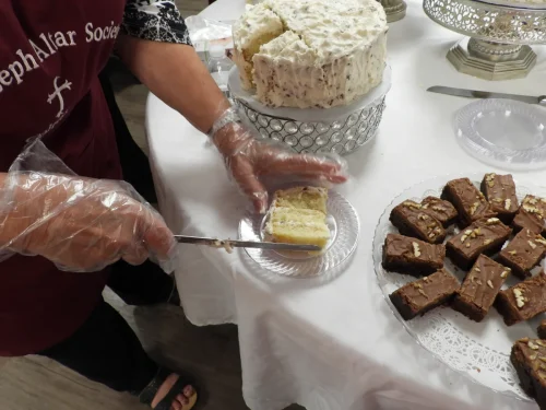 Serving cake from the St. Joseph Church, Colfax table. Desserts with the Seminarians held at Maryhill on Thursday, July 23. 